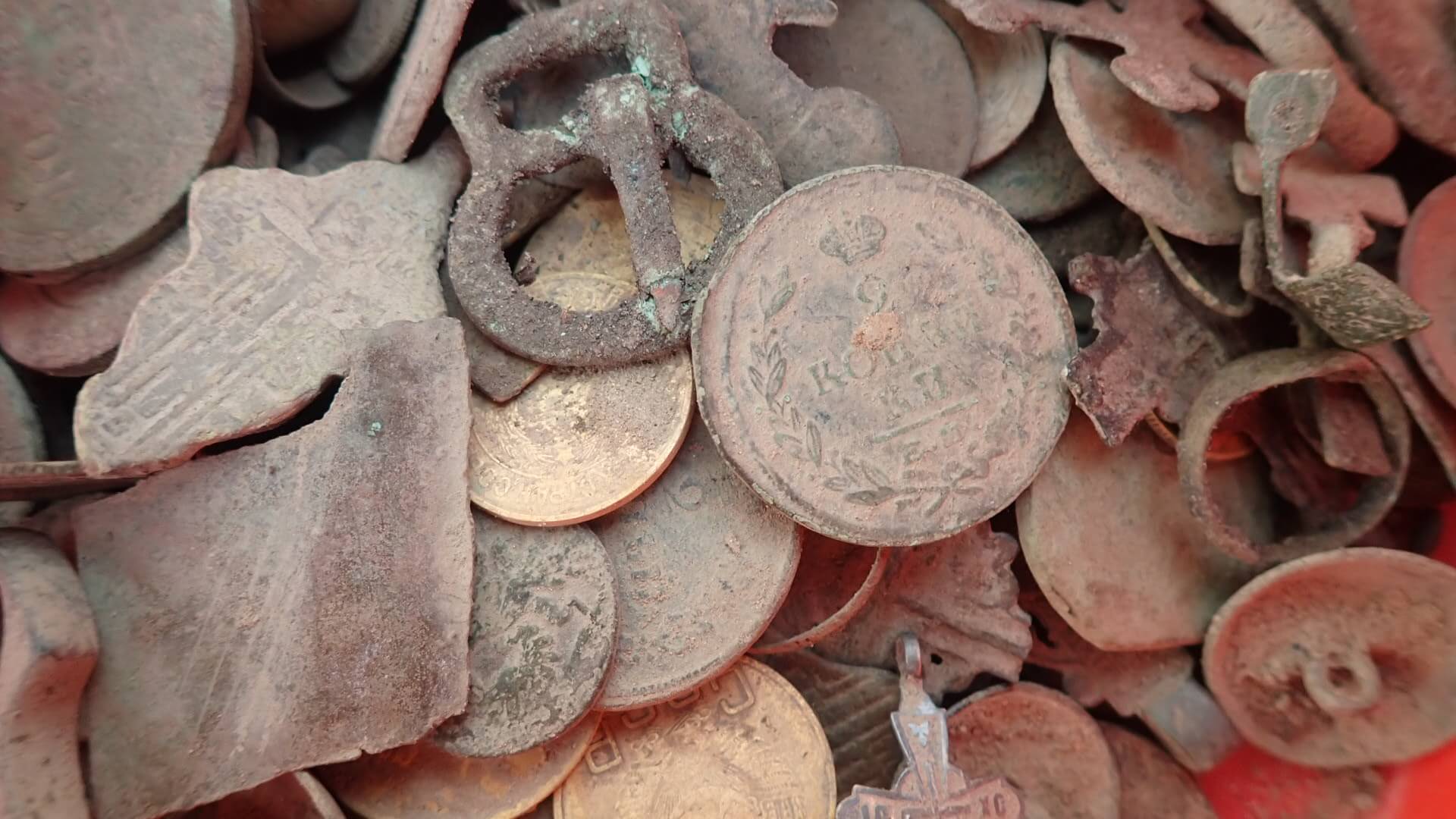 Cleaning copper coins in soapy water