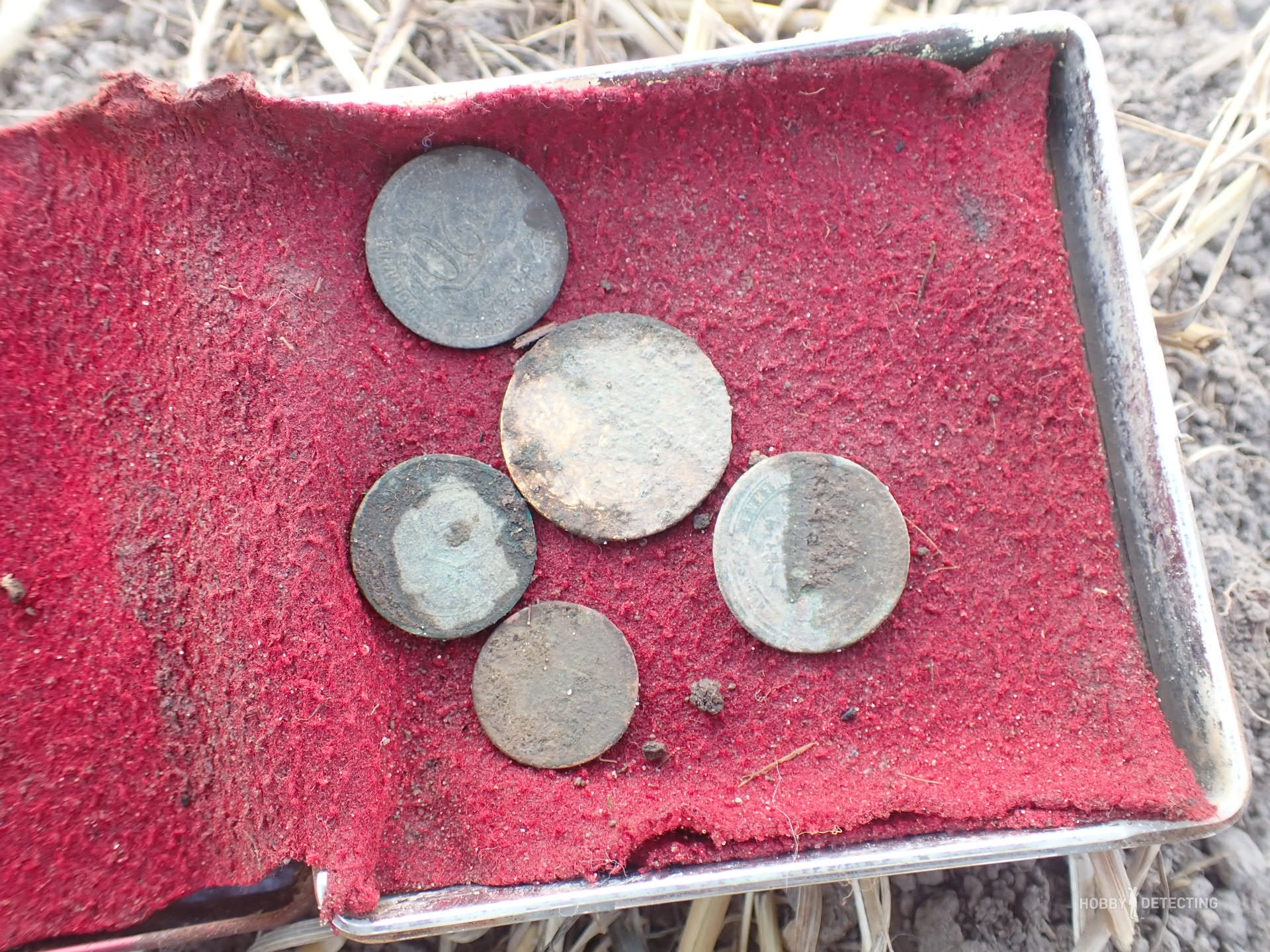 How does plowing a field affect the appearance of “new” coins?